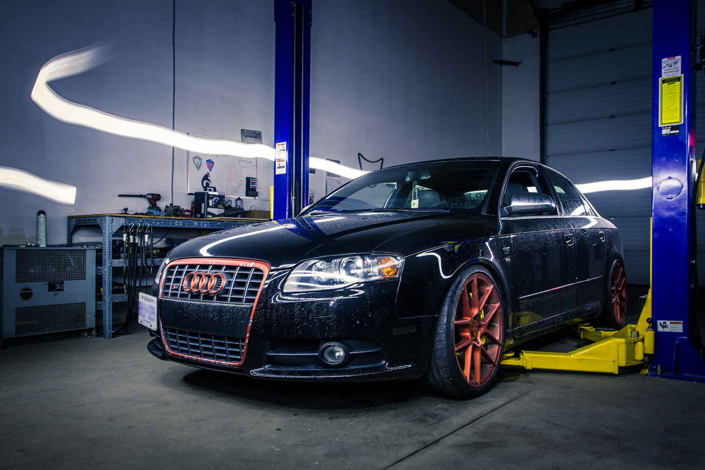 A cool photo of a light-painted car parked in a garage