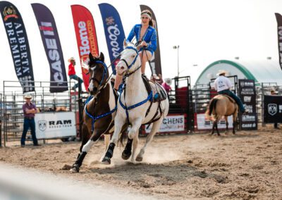 Action and sports photography of horse riding at the 2025 Headwaters Ram Rodeo at Orangeville Fairgrounds by Frank Myrland Photography