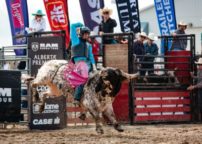 Action and sports photography of bull riding at the 2025 Headwaters Ram Rodeo at Orangeville Fairgrounds by Frank Myrland Photography
