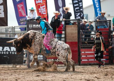 Action and sports photography of bull riding at the 2025 Headwaters Ram Rodeo at Orangeville Fairgrounds by Frank Myrland Photography