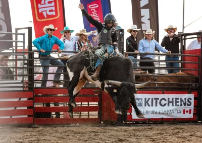 Action and sports photography of horse barrel racing at the 2025 Headwaters Ram Rodeo at Orangeville Fairgrounds by Frank Myrland Photography
